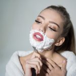 girl shaves her face