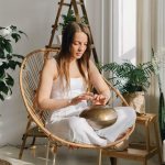 Girl sitting in a chair in lotus position