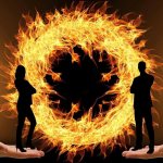 Man and woman against the background of a ring of fire (fantasy)