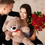 the guy gave the girl flowers and a bear